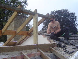 Jordon removing some brickwork to avoid the cold bridge